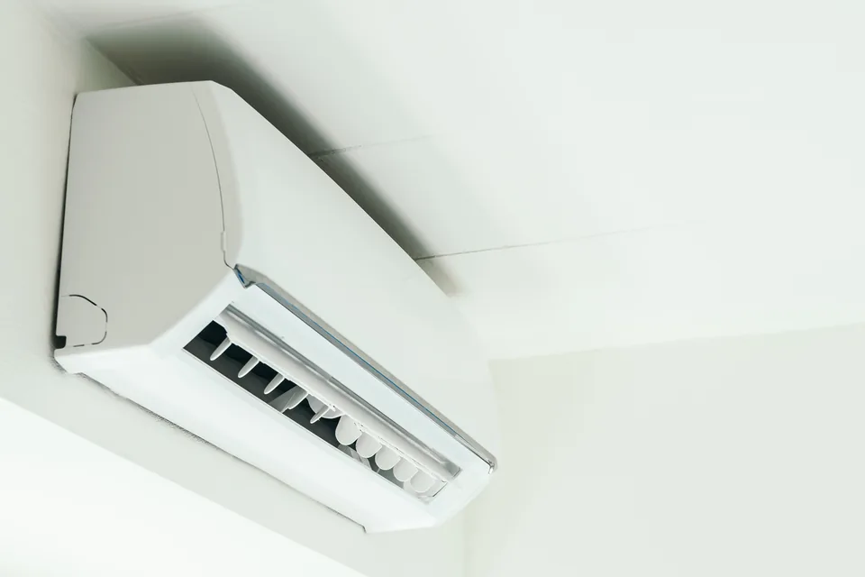 Installed high-wall heat pump with its air outlet open